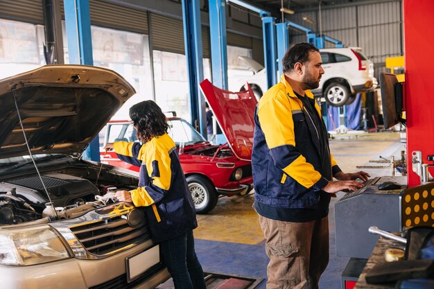 Mechanics working on vehicle maintenance